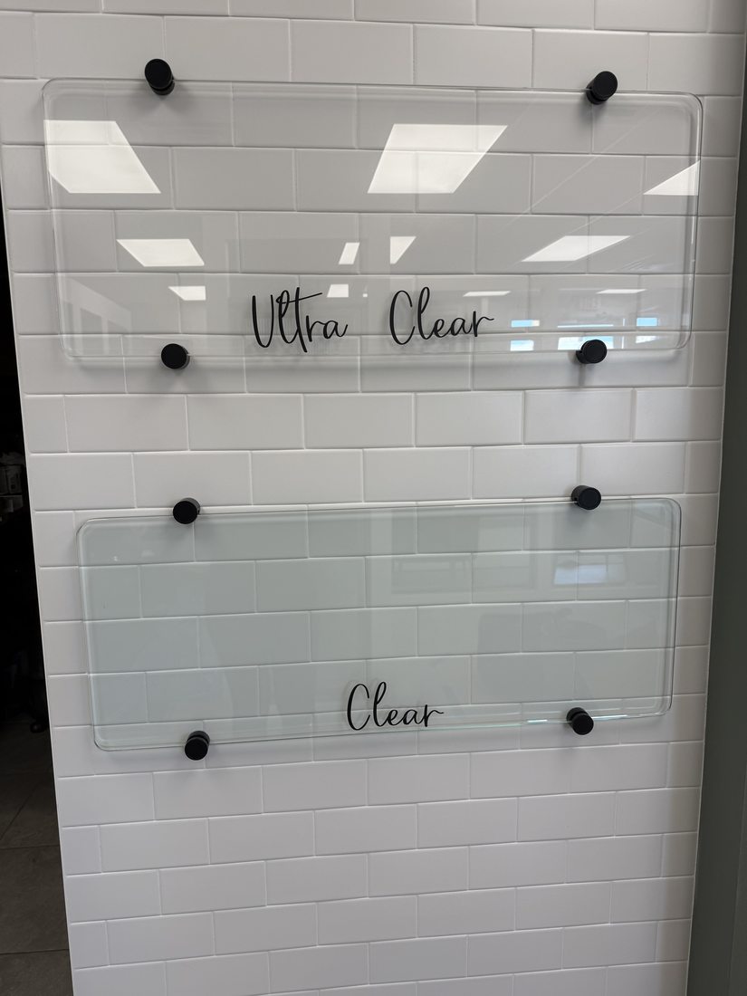 Side-by-side comparison of ultra-clear low-iron glass and standard clear glass showing the green tint difference