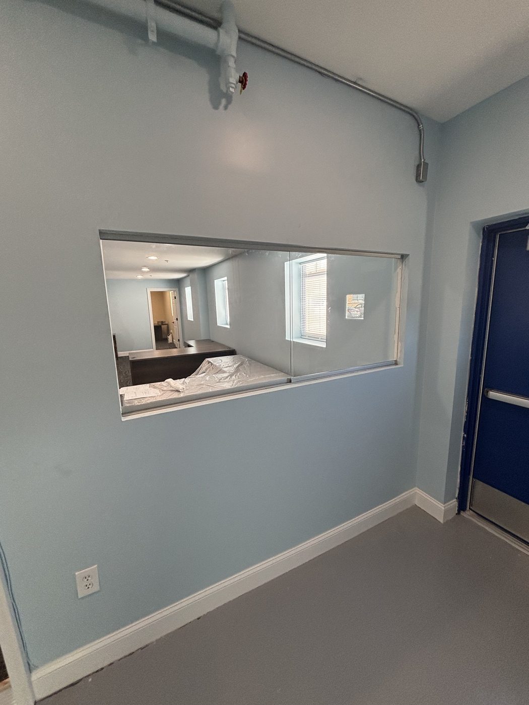 Interior office window with sliding glass panels