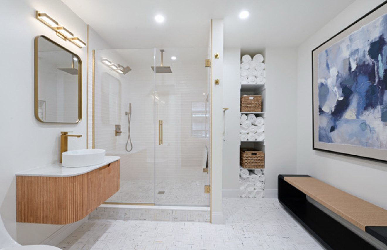 Large frameless wall mirror in a finished room